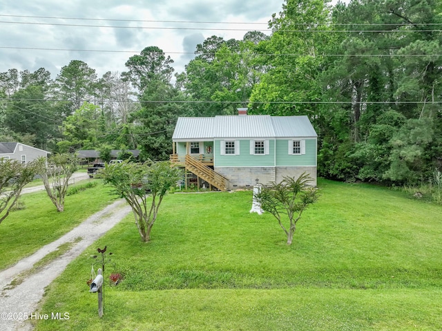766 Swan Point Rd, Washington, NC 27889 - view of front of property featuring stairs, dirt driveway, a front lawn, and a metal roof