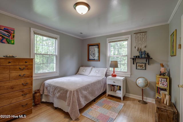 766 Swan Point Rd, Washington, NC 27889 - bedroom featuring light wood-type flooring, multiple windows, and crown molding