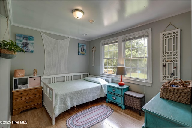 766 Swan Point Rd, Washington, NC 27889 - bedroom with wood finished floors and crown molding