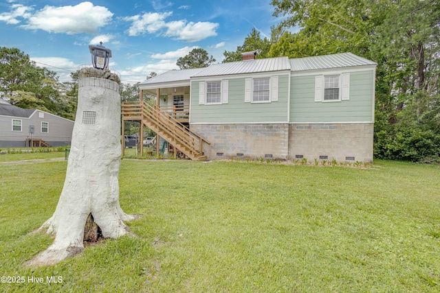 766 Swan Point Rd, Washington, NC 27889 - back of property with crawl space, stairway, a lawn, and a metal roof