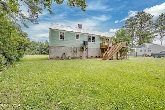 766 Swan Point Rd, Washington, NC 27889 - rear view of property with stairway, a chimney, a lawn, and a wooden deck