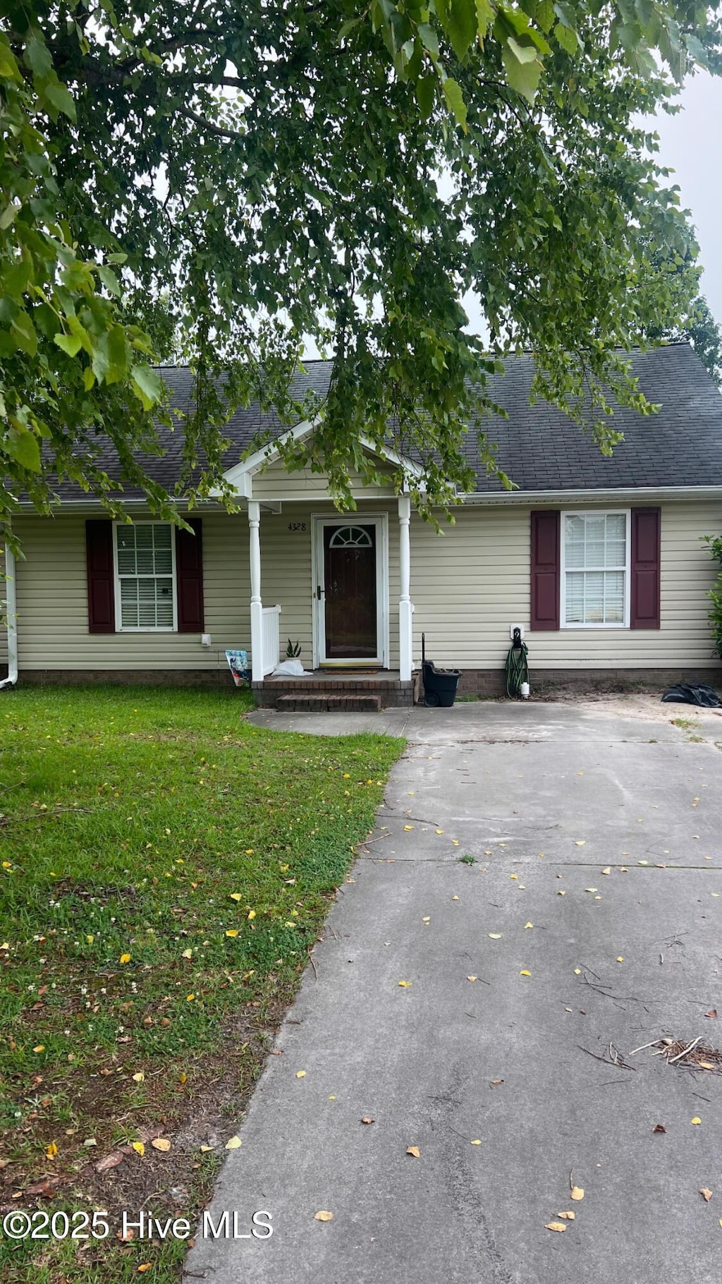 4328 Magellan Ct Unit B, Ayden, NC 28513 - view of front of property featuring a front lawn, asphalt driveway, and a shingled roof