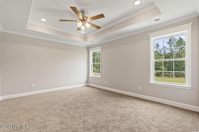414 Laurel Ct NW, Calabash, NC 28467 - carpeted spare room featuring a raised ceiling, crown molding, ceiling fan, and recessed lighting