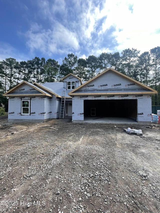414 Laurel Ct NW, Calabash, NC 28467 - property under construction featuring dirt driveway and a garage