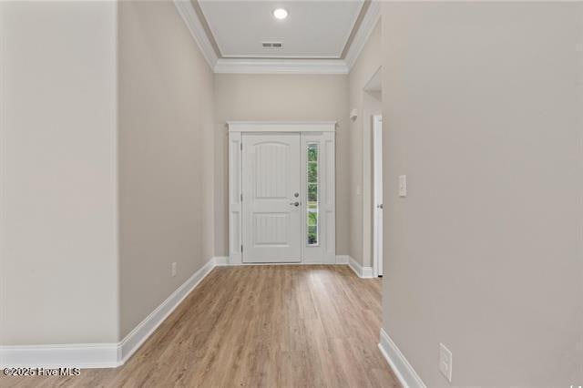 414 Laurel Ct NW, Calabash, NC 28467 - entryway with crown molding and light wood-type flooring