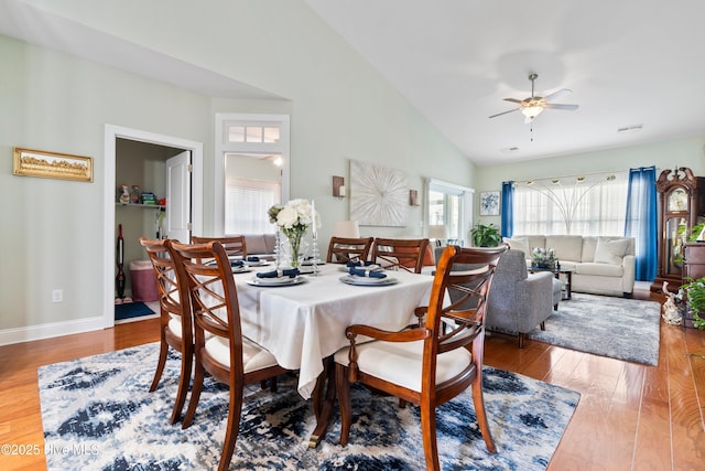 1067 Tideline Dr, Leland, NC 28451 - dining room featuring a ceiling fan, wood finished floors, and high vaulted ceiling