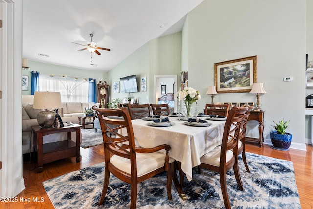 1067 Tideline Dr, Leland, NC 28451 - dining area with a ceiling fan, wood finished floors, and high vaulted ceiling
