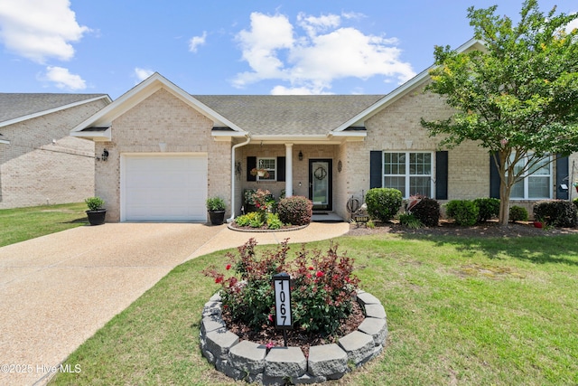 1067 Tideline Dr, Leland, NC 28451 - view of front of house with brick siding, a garage, concrete driveway, a front yard, and roof with shingles