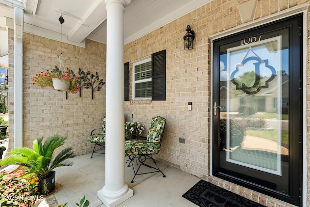 1067 Tideline Dr, Leland, NC 28451 - view of exterior entry with a porch and brick siding