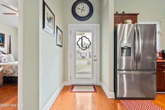 1067 Tideline Dr, Leland, NC 28451 - doorway with light wood-type flooring and a ceiling fan