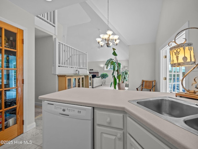 403 Emerald Landing Dr, Emerald Isle, NC 28594 - kitchen featuring dishwasher, a chandelier, vaulted ceiling, light countertops, and white cabinetry
