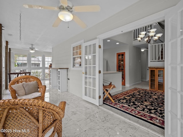 403 Emerald Landing Dr, Emerald Isle, NC 28594 - sunroom featuring french doors and a chandelier