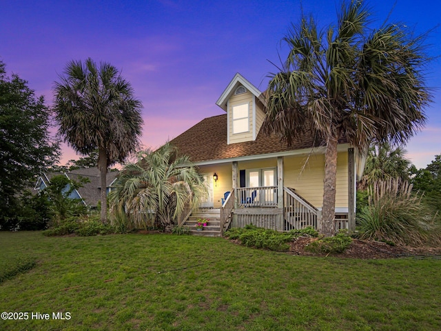 403 Emerald Landing Dr, Emerald Isle, NC 28594 - view of front of home featuring stairway, a porch, a yard, and roof with shingles