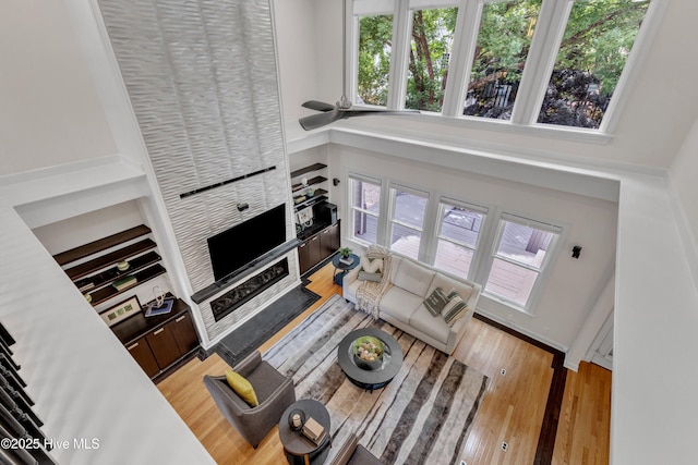 403 Emerald Landing Dr, Emerald Isle, NC 28594 - living room with plenty of natural light, wood finished floors, and a towering ceiling