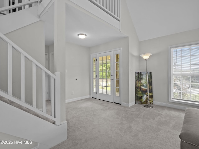 403 Emerald Landing Dr, Emerald Isle, NC 28594 - carpeted entrance foyer with stairway and a towering ceiling