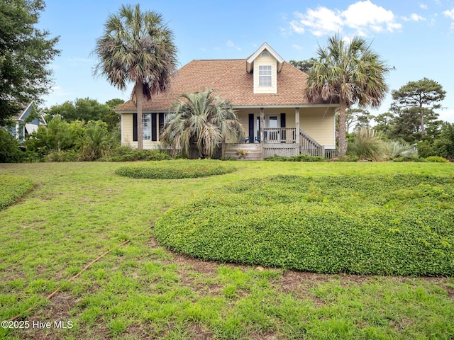 403 Emerald Landing Dr, Emerald Isle, NC 28594 - view of front facade with a porch, a front lawn, and a shingled roof