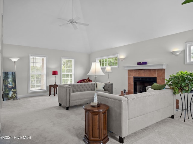 403 Emerald Landing Dr, Emerald Isle, NC 28594 - living room with light carpet, a tile fireplace, a ceiling fan, and vaulted ceiling