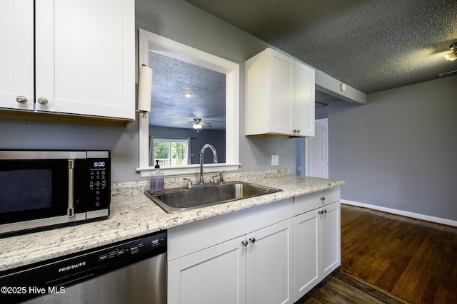 103 Elizabeth St, Havelock, NC 28532 - kitchen with appliances with stainless steel finishes, a textured ceiling, white cabinetry, dark wood-style flooring, and ceiling fan