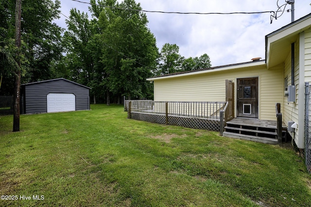 103 Elizabeth St, Havelock, NC 28532 - view of grassy yard with a garage, a wooden deck, an outbuilding, and driveway