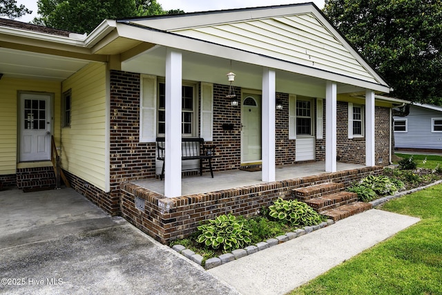103 Elizabeth St, Havelock, NC 28532 - view of exterior entry featuring brick siding and covered porch