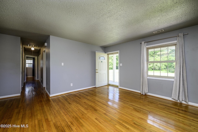103 Elizabeth St, Havelock, NC 28532 - empty room with a textured ceiling and hardwood / wood-style flooring