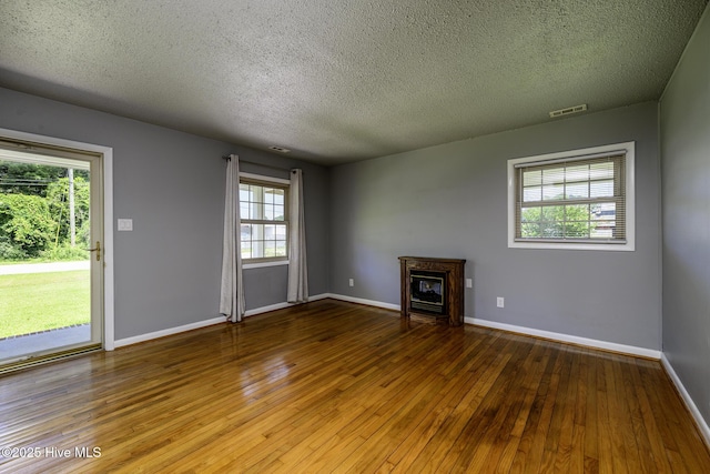103 Elizabeth St, Havelock, NC 28532 - unfurnished living room with hardwood / wood-style flooring and a textured ceiling