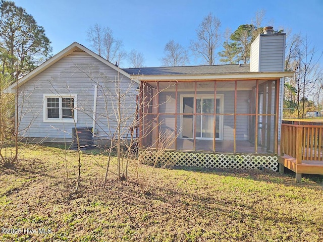 2823 Harvest, Grimesland, NC 27837 - back of property with a sunroom, a chimney, and a shingled roof