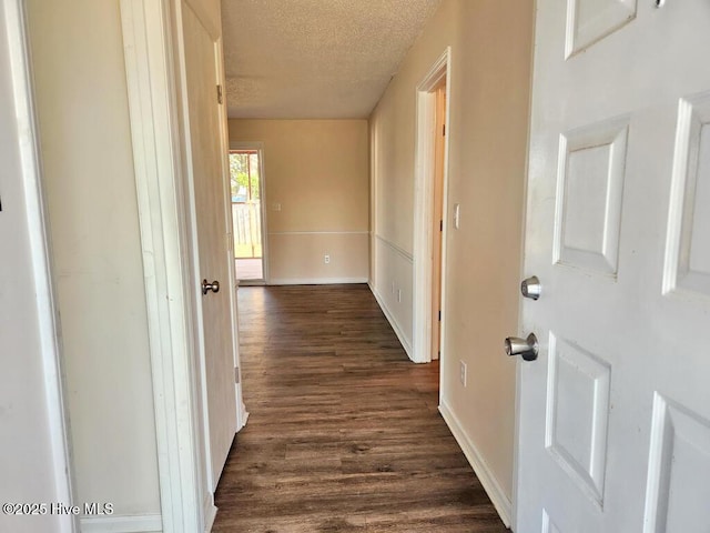 2823 Harvest, Grimesland, NC 27837 - corridor featuring a textured ceiling and dark wood-style flooring