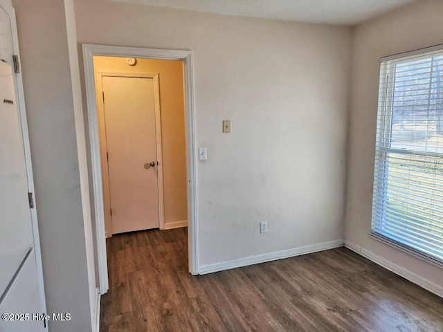 2823 Harvest, Grimesland, NC 27837 - unfurnished room with dark wood finished floors and baseboards