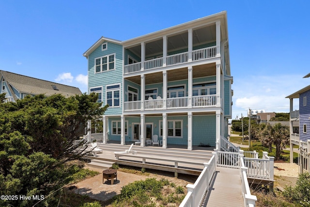 4101 Ocean Dr, Emerald Isle, NC 28594 - rear view of house with a balcony