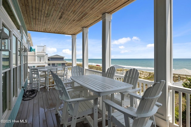 4101 Ocean Dr, Emerald Isle, NC 28594 - wooden deck featuring view of water and beach and outdoor dining area
