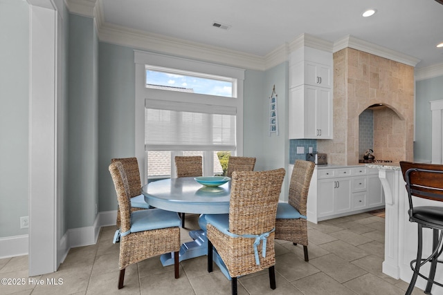 4101 Ocean Dr, Emerald Isle, NC 28594 - dining space featuring ornamental molding, light tile patterned floors, and recessed lighting