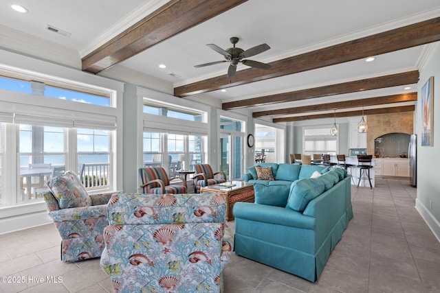 4101 Ocean Dr, Emerald Isle, NC 28594 - tiled living room with plenty of natural light, beamed ceiling, a ceiling fan, crown molding, and recessed lighting