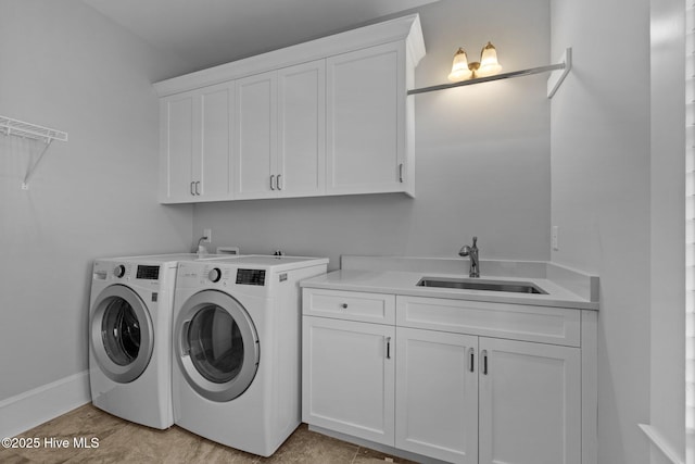 4101 Ocean Dr, Emerald Isle, NC 28594 - laundry room with cabinet space and washing machine and clothes dryer