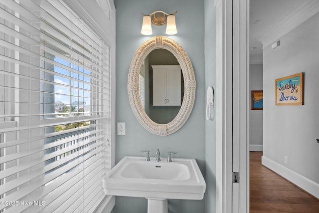 4101 Ocean Dr, Emerald Isle, NC 28594 - bathroom with wood finished floors and crown molding