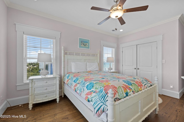 4101 Ocean Dr, Emerald Isle, NC 28594 - bedroom featuring dark wood finished floors, a closet, crown molding, and a ceiling fan