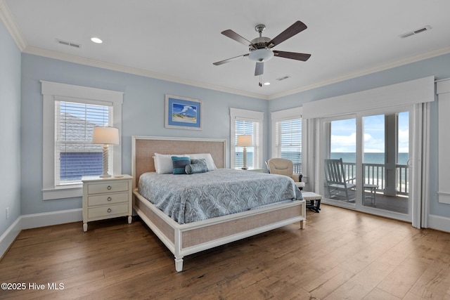 4101 Ocean Dr, Emerald Isle, NC 28594 - bedroom with access to exterior, ornamental molding, wood finished floors, a water view, and recessed lighting