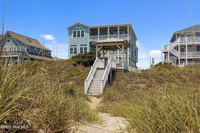 4101 Ocean Dr, Emerald Isle, NC 28594 - back of house featuring stairway