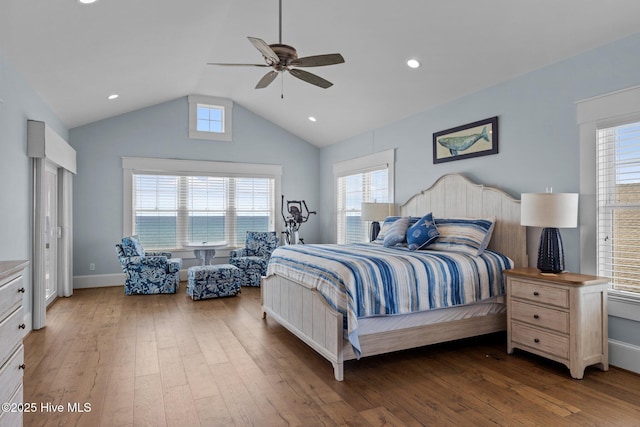 4101 Ocean Dr, Emerald Isle, NC 28594 - bedroom featuring hardwood / wood-style flooring, vaulted ceiling, multiple windows, ceiling fan, and recessed lighting