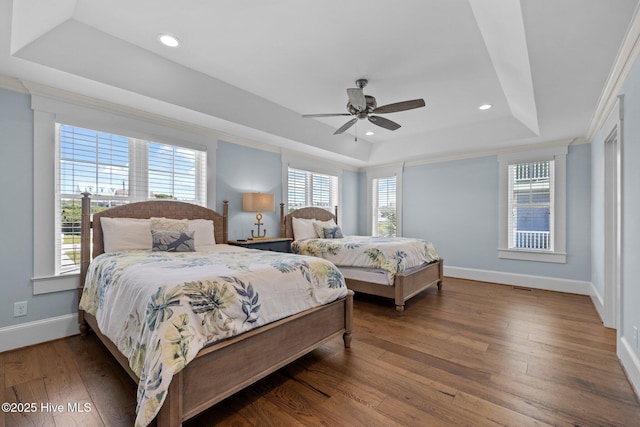 4101 Ocean Dr, Emerald Isle, NC 28594 - bedroom featuring a tray ceiling, wood finished floors, recessed lighting, ceiling fan, and ornamental molding