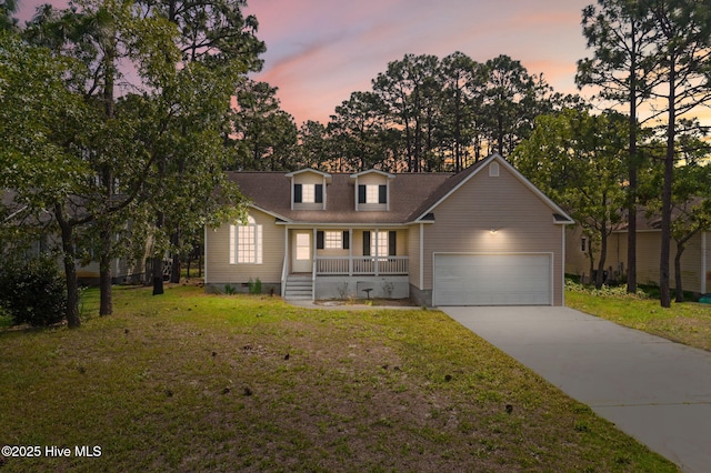1281 Washington Rd, Southport, NC 28461 - view of front of property with covered porch, a lawn, concrete driveway, and an attached garage