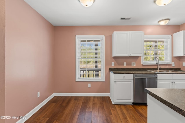 1281 Washington Rd, Southport, NC 28461 - kitchen with dishwasher, dark countertops, and dark wood-type flooring