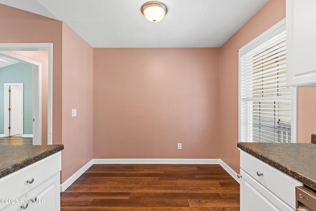 1281 Washington Rd, Southport, NC 28461 - unfurnished dining area featuring dark wood finished floors and baseboards