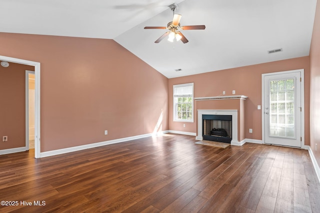 1281 Washington Rd, Southport, NC 28461 - unfurnished living room featuring lofted ceiling, ceiling fan, dark wood-type flooring, and a fireplace with flush hearth