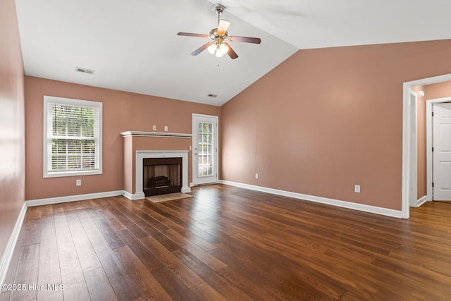1281 Washington Rd, Southport, NC 28461 - unfurnished living room with a ceiling fan, lofted ceiling, dark wood-type flooring, and a fireplace with flush hearth
