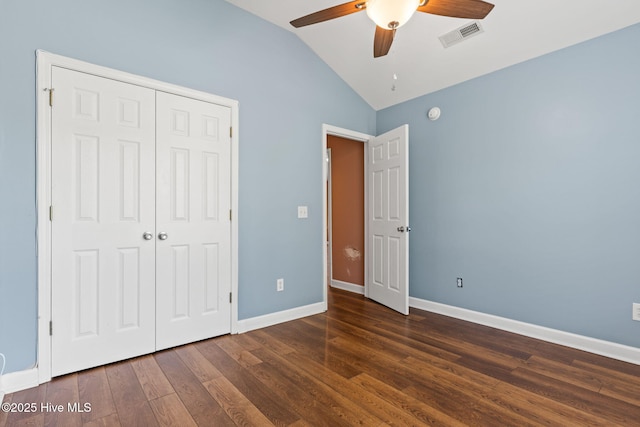 1281 Washington Rd, Southport, NC 28461 - unfurnished bedroom with lofted ceiling, wood finished floors, a closet, and a ceiling fan