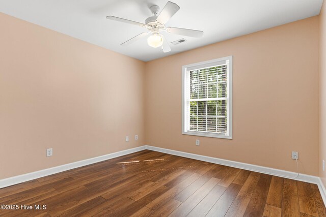 1281 Washington Rd, Southport, NC 28461 - spare room featuring dark wood-style floors and a ceiling fan