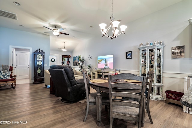 1284 Marsilio Ln SW Unit B, Ocean Isle Beach, NC 28469 - dining area with wood finished floors, a chandelier, and ceiling fan