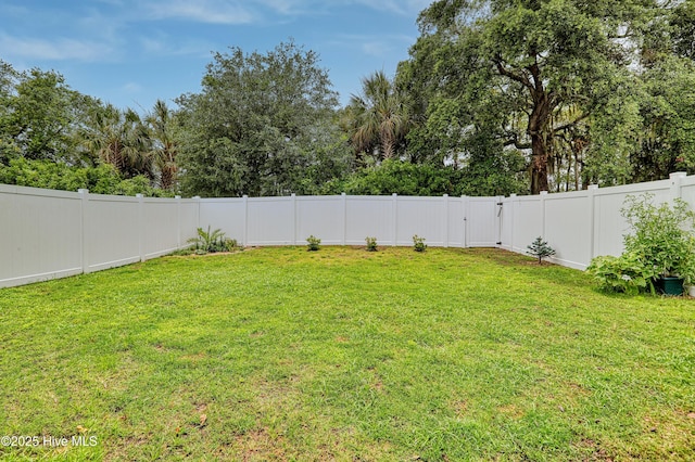1284 Marsilio Ln SW Unit B, Ocean Isle Beach, NC 28469 - fenced backyard with view of wooded area