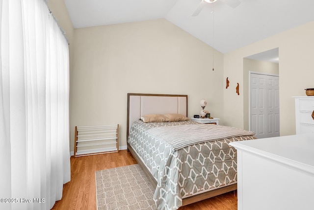 2129 Cass Lake Dr, Calabash, NC 28467 - bedroom featuring vaulted ceiling, light wood-style flooring, a closet, and a ceiling fan